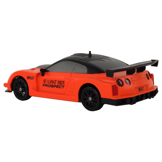 Nuotoliniu būdu valdomas sportinis automobilis R/C 1:24 oranžinės spalvos keičiamais ratais Radijo bangomis valdomi žaislai