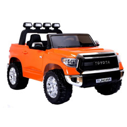 Oranžinis Toyota Tundra visureigis