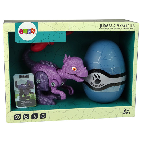 Mėlynas dinozauro kiaušinis su išardomu violetiniu dinozauru Dinozaurai