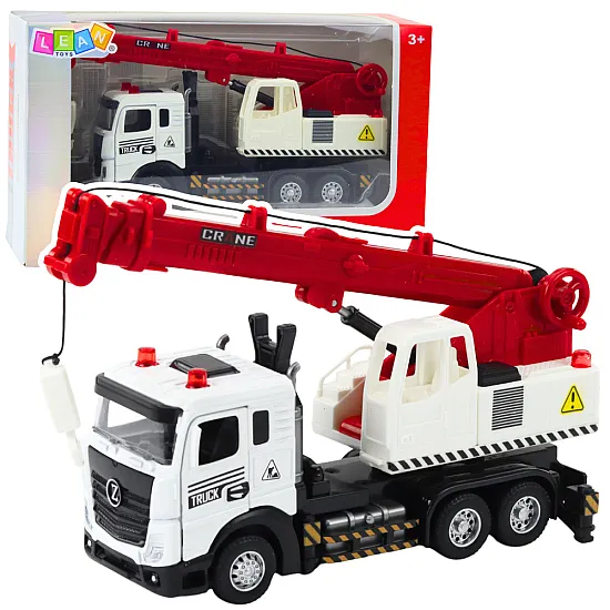 Truck with crane, metal cab, adjustable boom, light and sound system