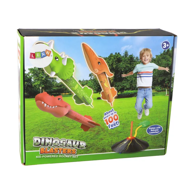 Czarny wulkan z rakietami w kształcie dinozaurów. Dinozaury